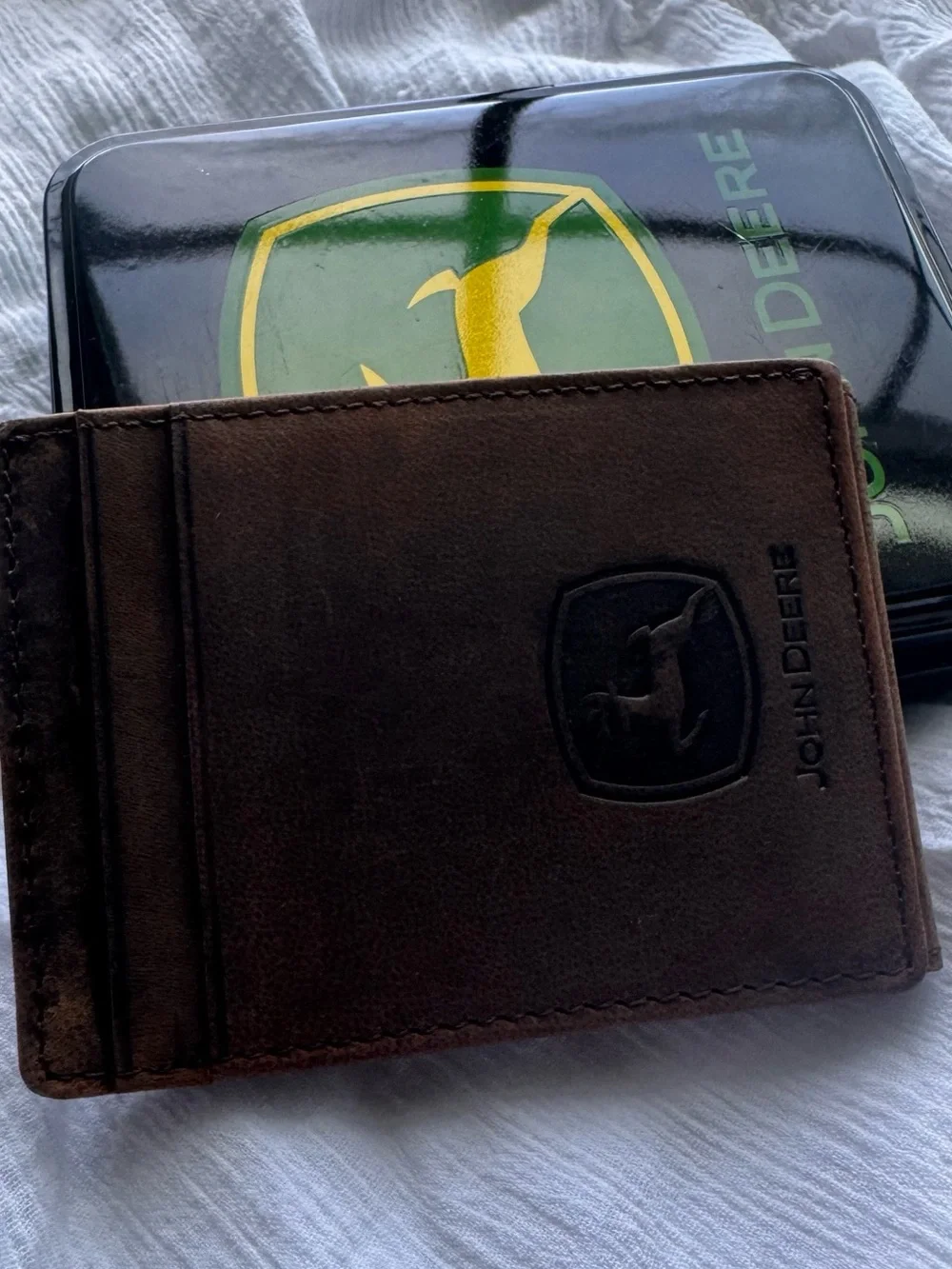 John Deere genuine leather money clip wallet in its original collectible tin.